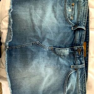 Joe The Jessica" denim mini skirt with light whiskering and frayed hem